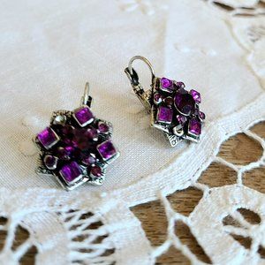 Large earrings with purple rhinestones. France.